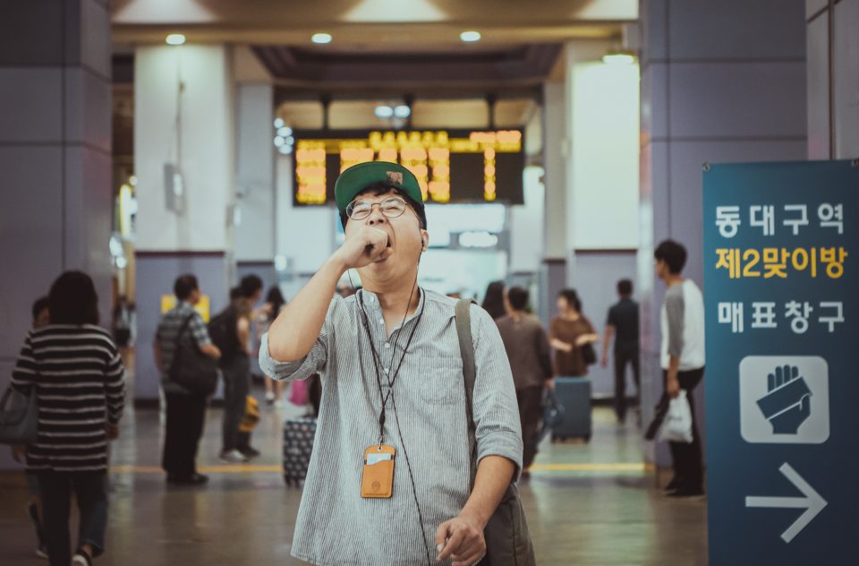 Tired man yawn at Korea subway